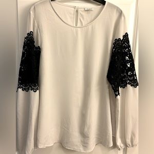 White blouse with black crochet sleeves
